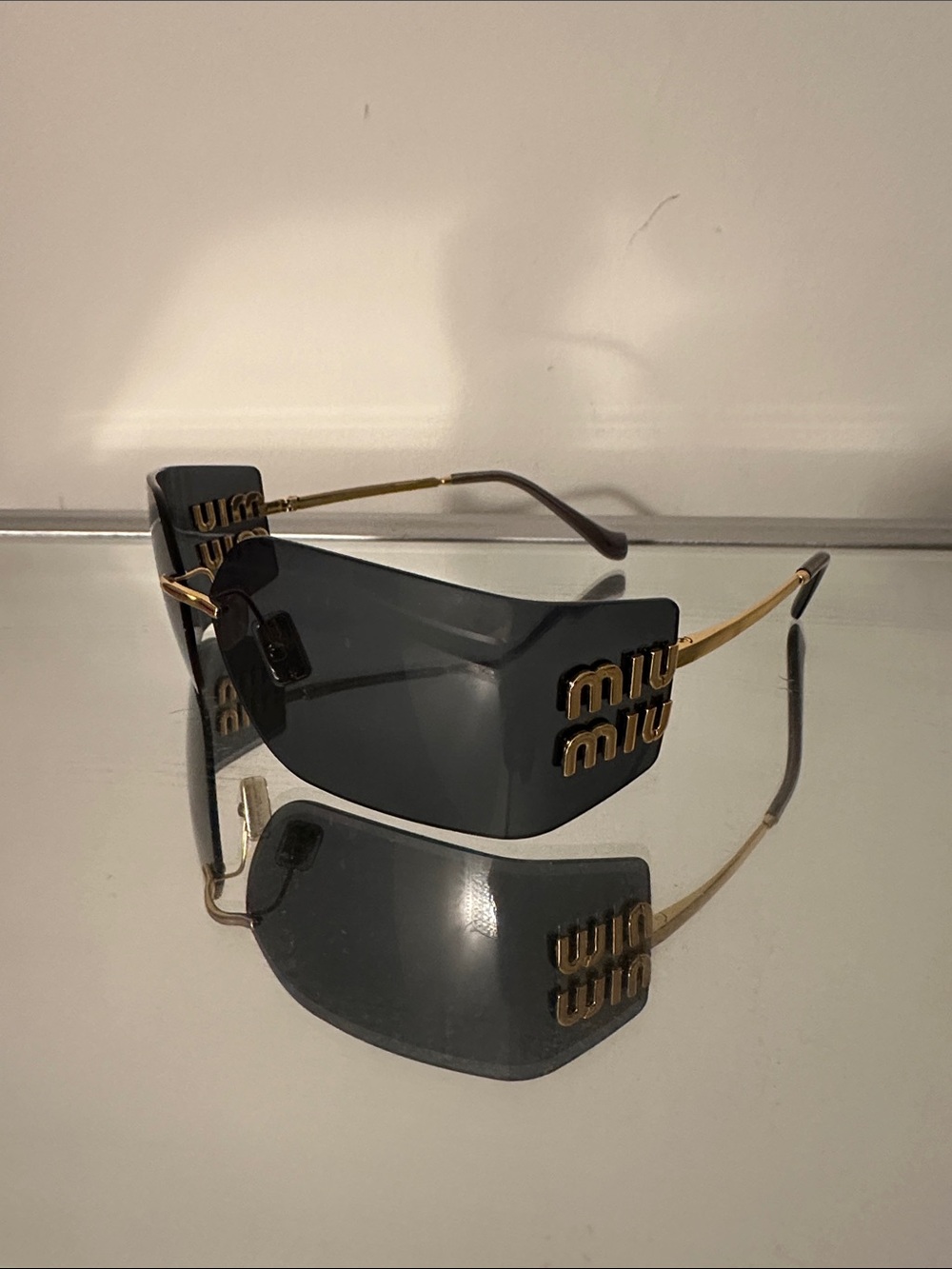 Miu Miu Dark Gray Shield Sunglasses with Gold Logo Arms
